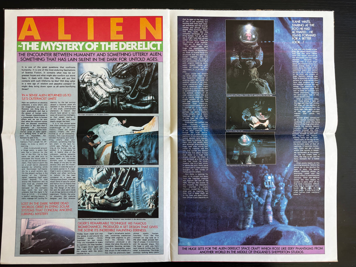 An open vintage magazine spread featuring cover articles about the movie Alien, with blue-toned sci-fi artwork, text columns, and comic-style panels on both pages.